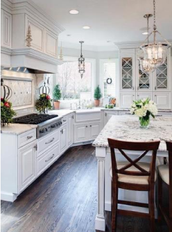 A picture of a white interior kitchen with dining area